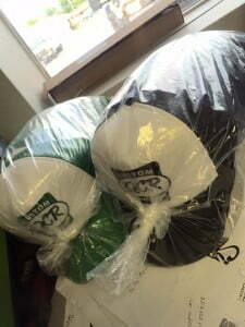 Green/white & Black/ white hats with the words Custom QCR Car Show done by the sign prints of joplin, MO.